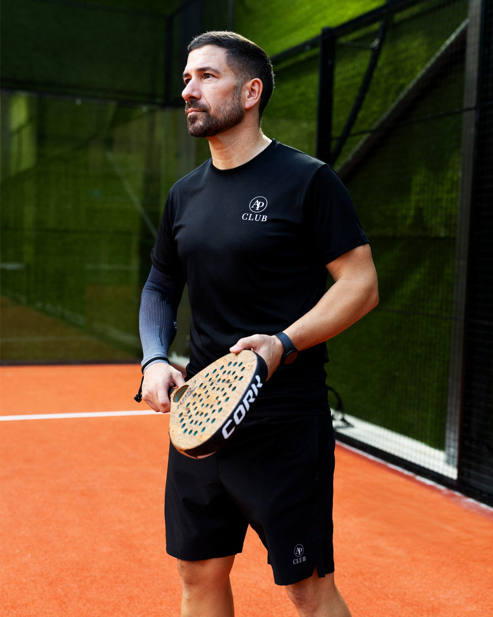 Vitor Silva holding a padel racket on court in AP CLUB kit