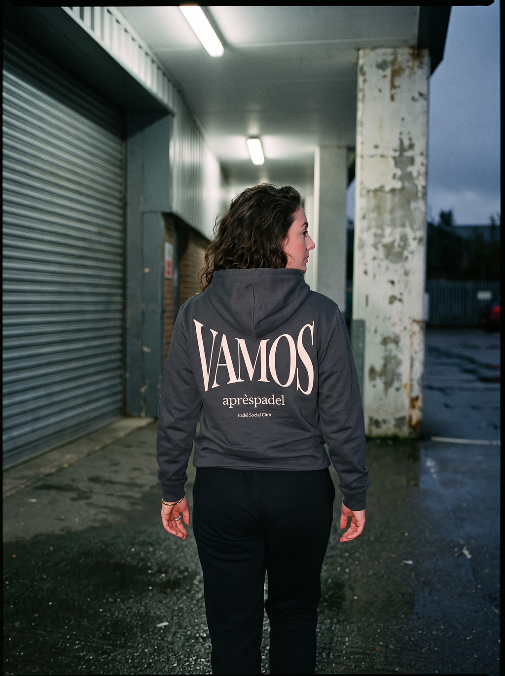Black AP Club Vamos padel hoodie in the court corridor