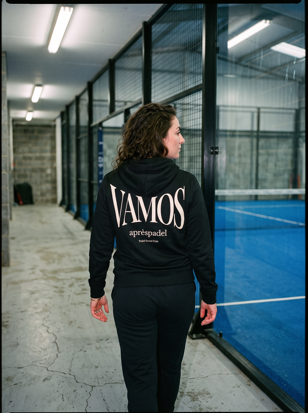 Charcoal AP Club Vamos padel hoodie in a wet-weather court setting