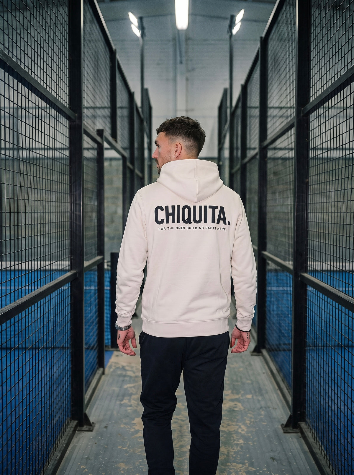 AP Club Chiquita Hoodie in Off White at a padel venue